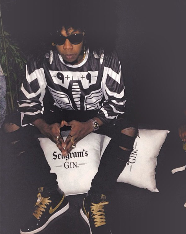 Trinidad James wearing Air Jordan 1 I Retro Black/Gold Patent