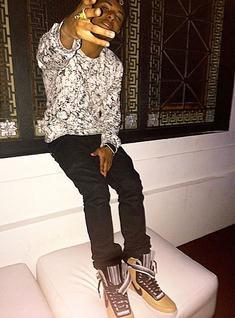 Diggy Simmons wearing Nike Air Force 1 High RT Beige
