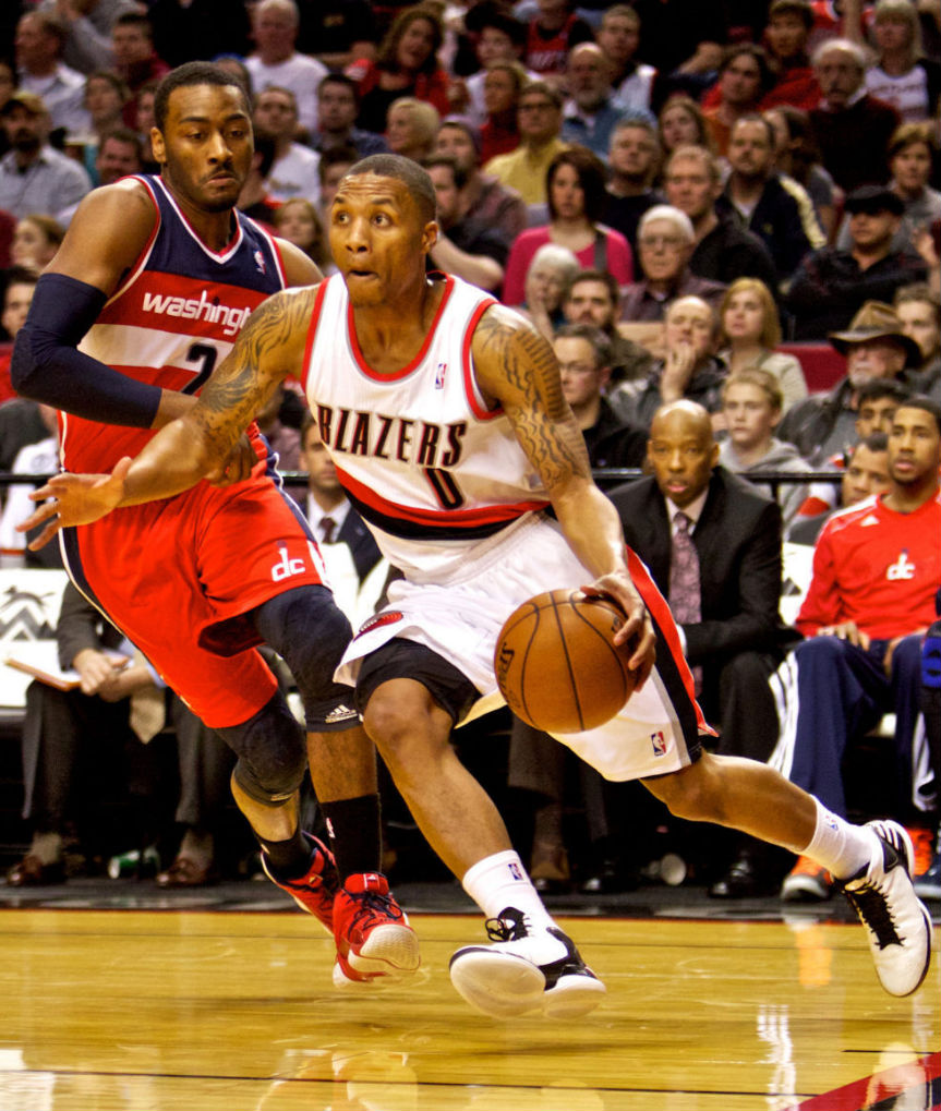 Damian Lillard wearing adias Rose 773; John Wall wearing adidas Top Ten 2000