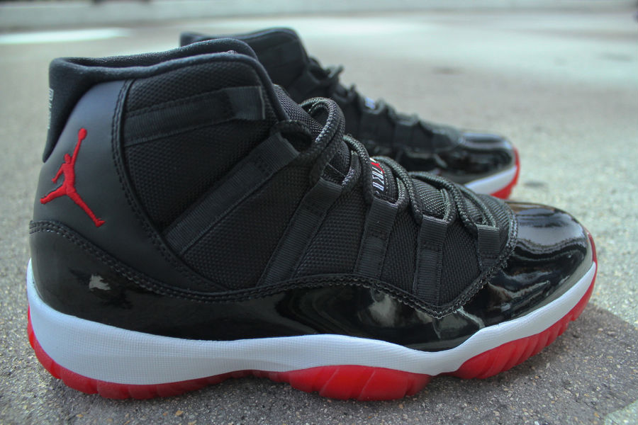 black white and red jordan 11s