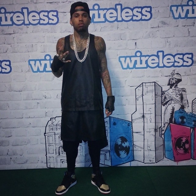 Kid Ink wearing Air Jordan I 1 Mid