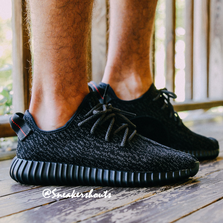 black yeezy 350 on feet