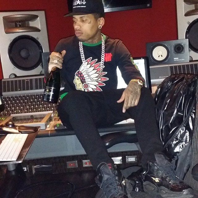 Kid Ink wearing Reebok Question Black/Gold