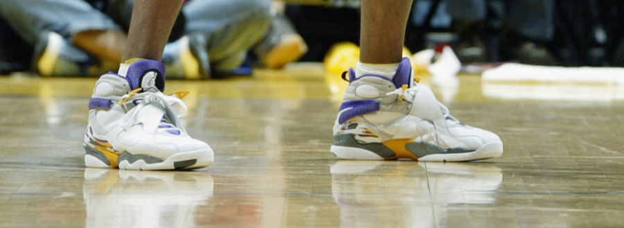 Kobe Bryant wearing number 8 jersey and Air Jordan Retro VIII PE shoes