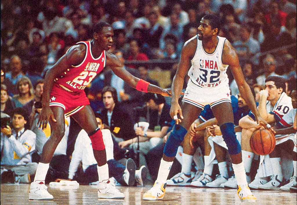 Michael Jordan wearing the Air Jordan II; Magic Johnson wearing the Converse Weapon