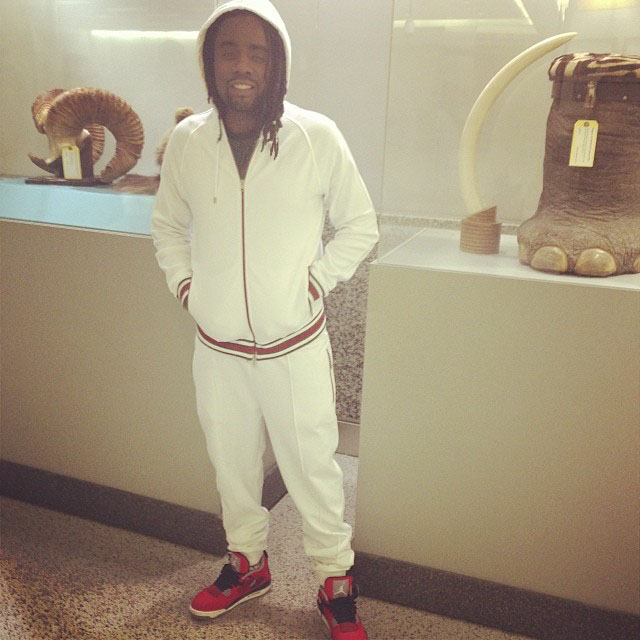 Wale wearing Air Jordan 4 Retro Toro