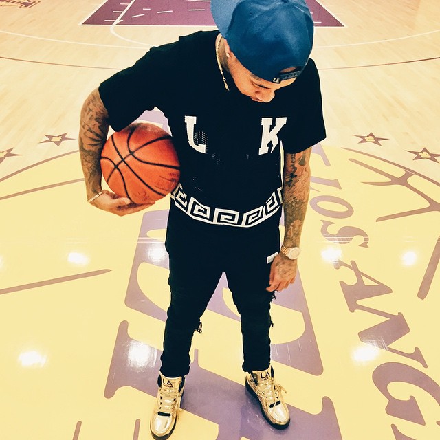 Tyga wearing LA Gear Lights Liquid Gold