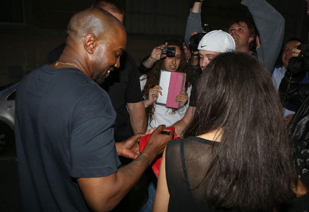 Kanye West Signs Fake Red October Nike Yeezy 2 Shoes
