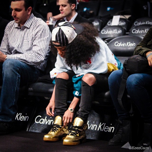 Teyana Taylor wearing Ewing 33 Hi Gold