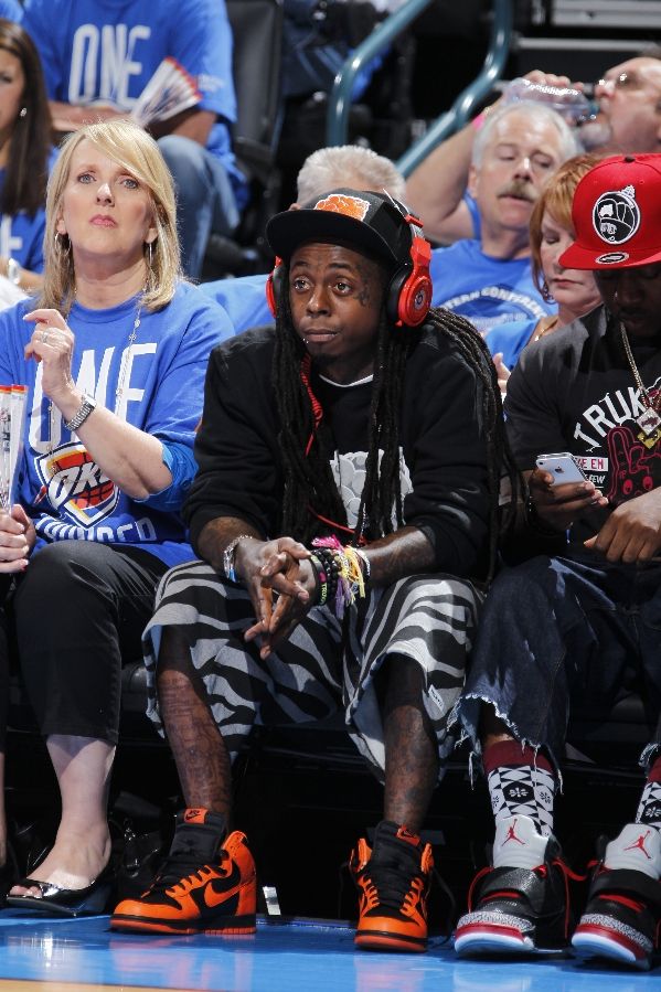Lil' Wayne wearing Nike Dunk High Black Orange
