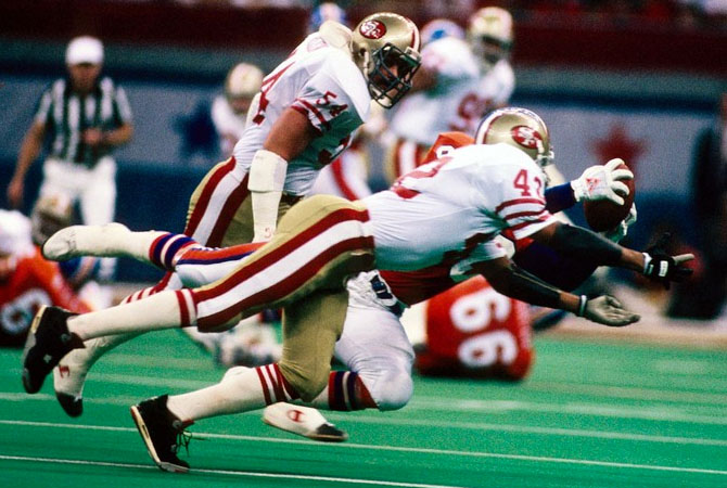 Ronnie Lott wearing Air Jordan IV 4 Bred (1990)