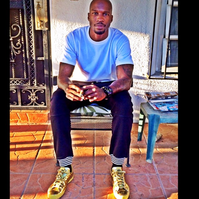 Chad Johnson wearing Jeremy Scott x adidas Originals Rod Laver