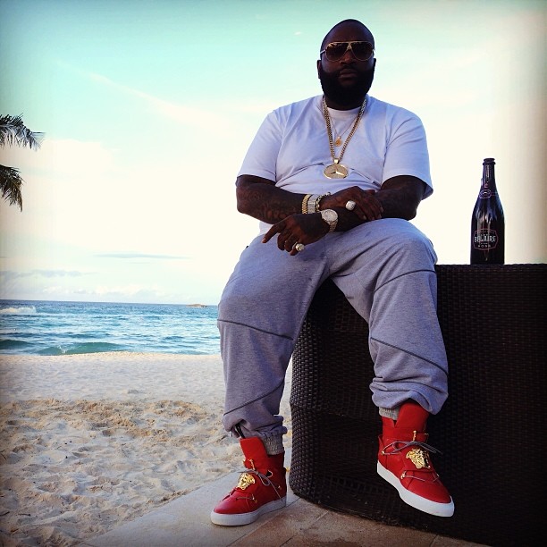 Rick Ross wearing Versace Medusa High-Top Sneakers