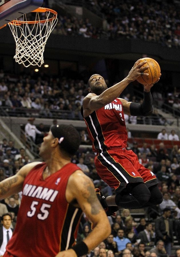 Dwyane Wade wears Black/Red/Orange Air Jordan 2011 PE against Pistons