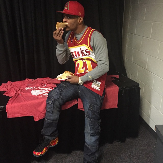 T.I. wearing Supreme x Nike Air Foamposite One Red