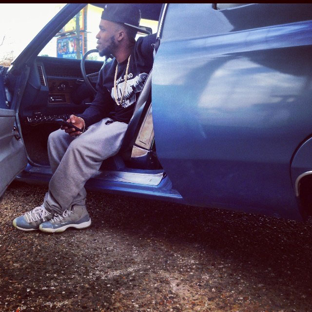 Currensy wearing Air Jordan 11 Retro Cool Grey