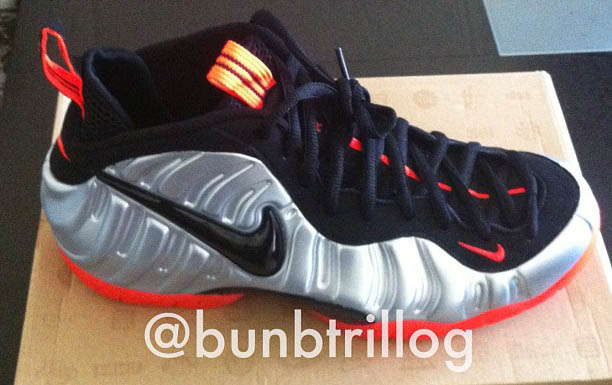 silver black and orange foamposites