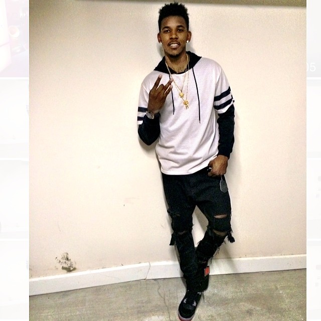 Nick Young wearing Air Jordan 4 Retro Black Cement