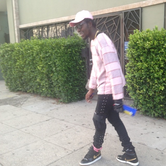 Theophilus London wearing Air Jordan I 1 Black/Gold