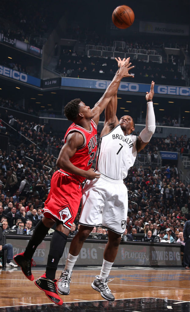 Jimmy Butler wearing adidas TMAC 1