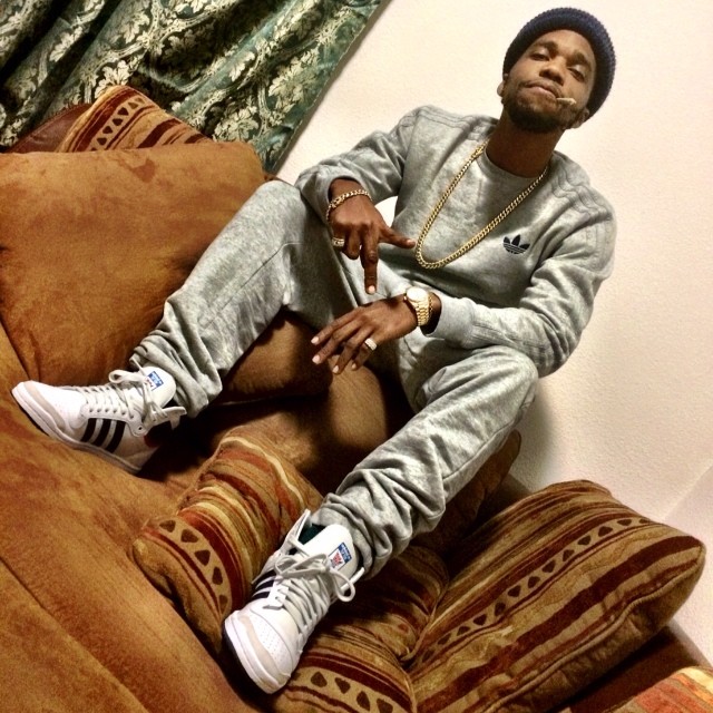 Currensy wearing adidas Originals Top Ten