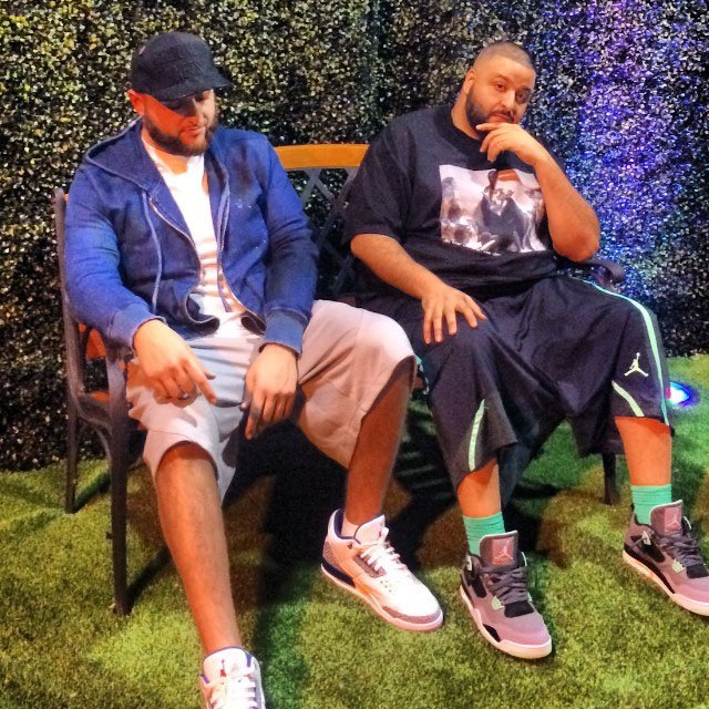 DJ Khaled wearing Air Jordan 4 Green Glow