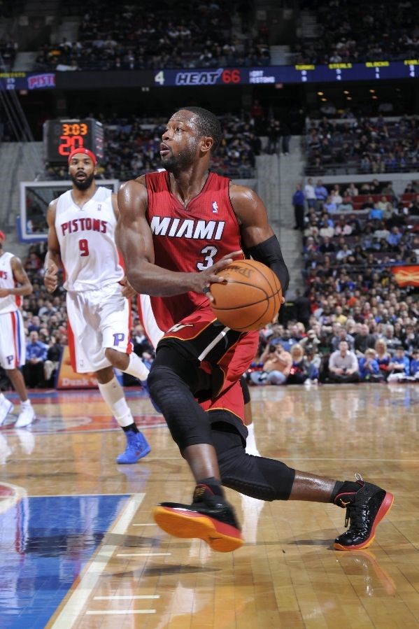 Dwyane Wade wears Black/Red/Orange Air Jordan 2011 PE against Pistons