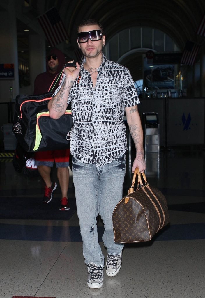 Riff Raff wearing Converse by John Varvatos Chuck Taylor All Star Snake