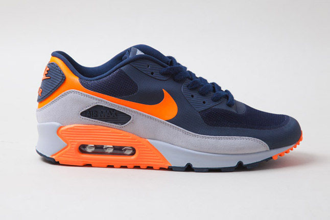 navy and orange nike shoes