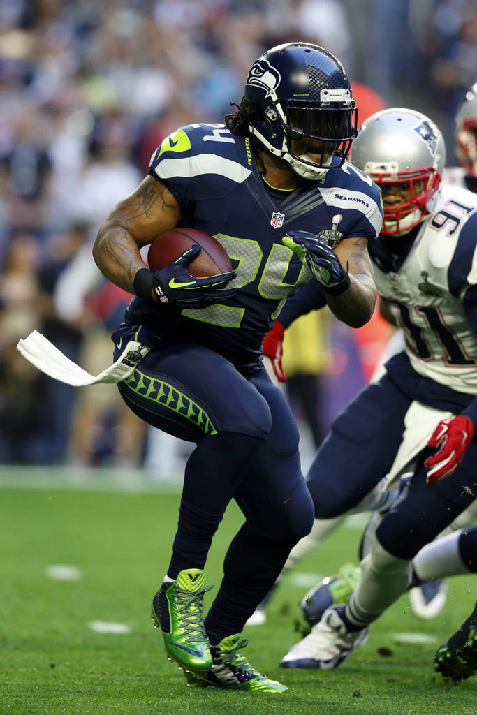 Marshawn Lynch wearing Nike Vapor Speed Mid