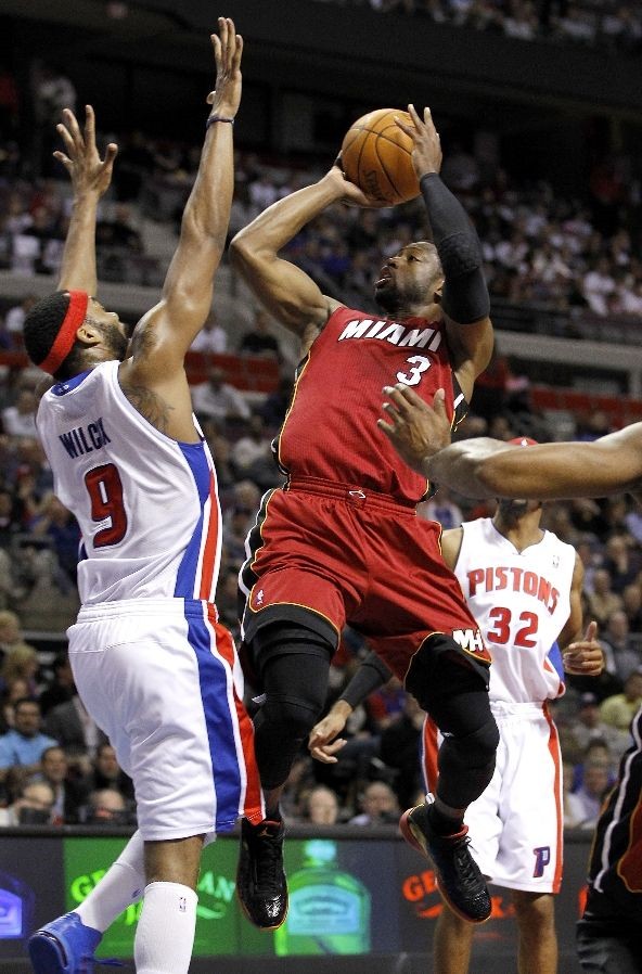 Dwyane Wade wears Black/Red/Orange Air Jordan 2011 PE against Pistons
