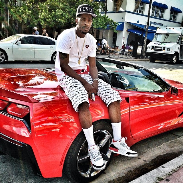 King Los wearing Air Jordan III 3 Fire Red