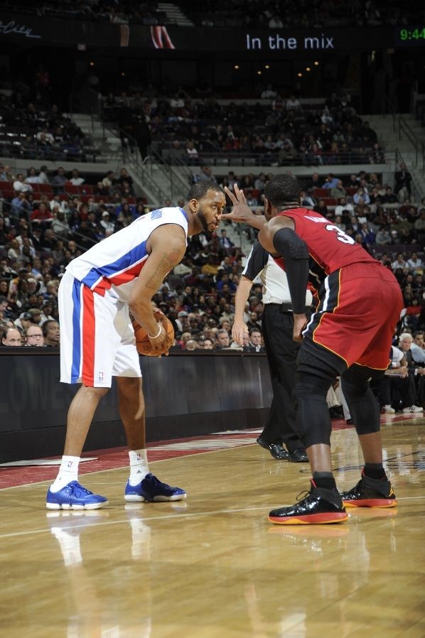 Dwyane Wade wears Black/Red/Orange Air Jordan 2011 PE against Pistons