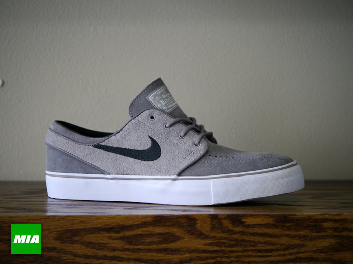 black and grey janoskis with A Reserve 