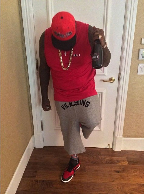 Rick Ross wearing Air Jordan I 1 Low Bred