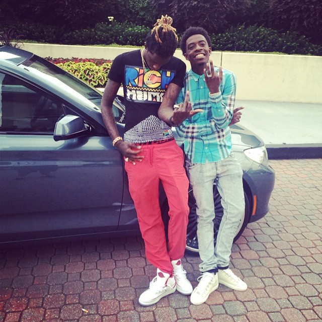 Young Thug wearing Air Jordan II 2 White/Red; Rich Homie Quan wearing Balenciaga Arena