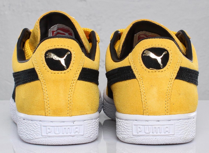 black and yellow puma suede