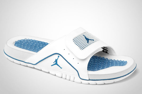 white and blue jordan slides