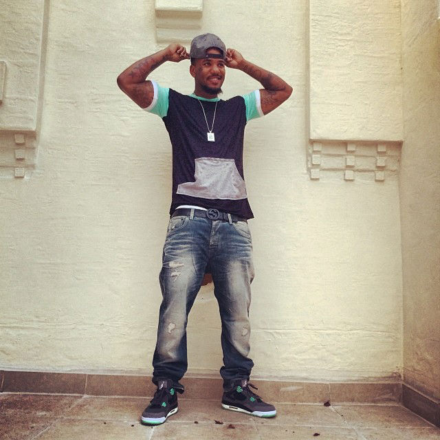 The Game wearing Air Jordan 4 IV Retro Green Glow