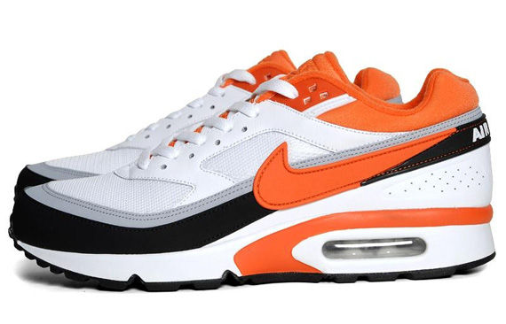 Orange black and white hotsell nike shoes