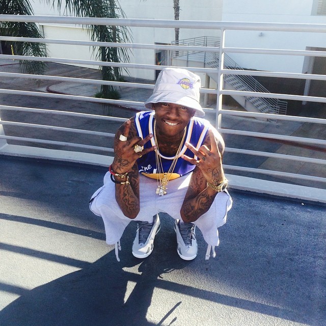 Soulja Boy wearing Air Jordan XIV 14 Wolf Grey Sport Blue