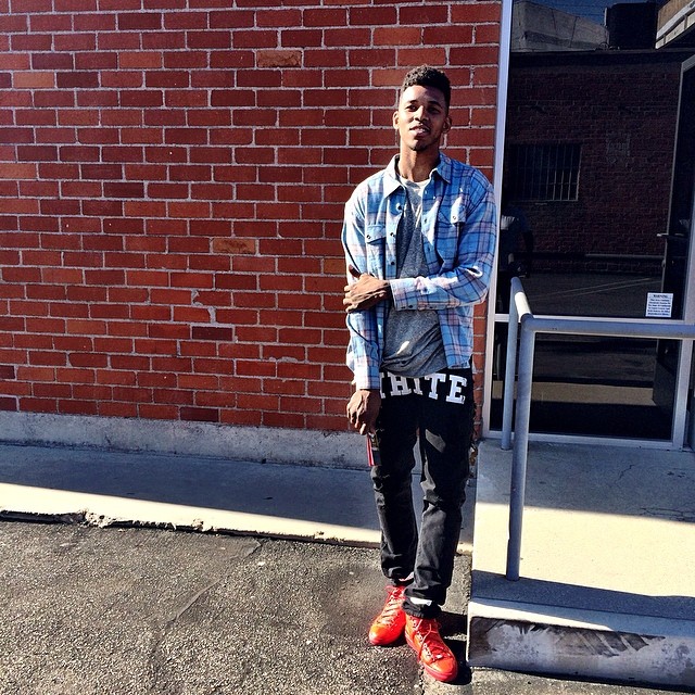 Nick Young wearing Balenciaga Arena