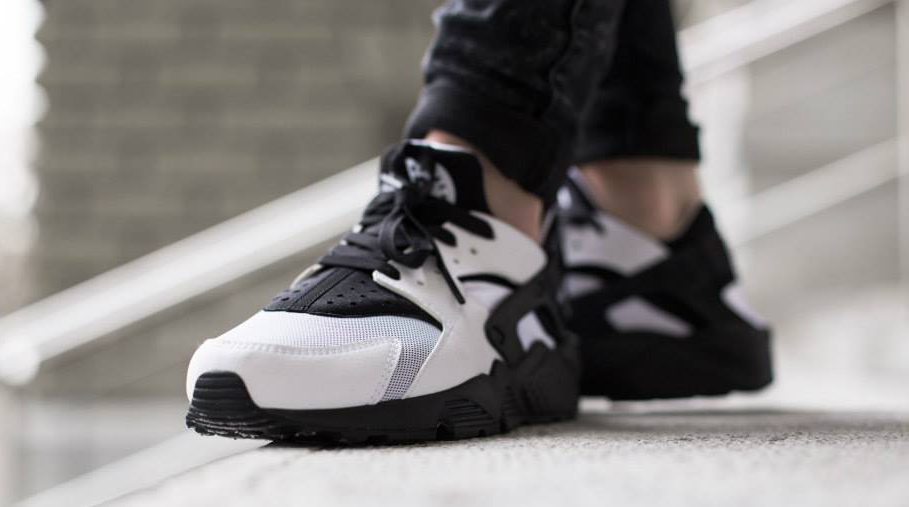 white huaraches with black logo