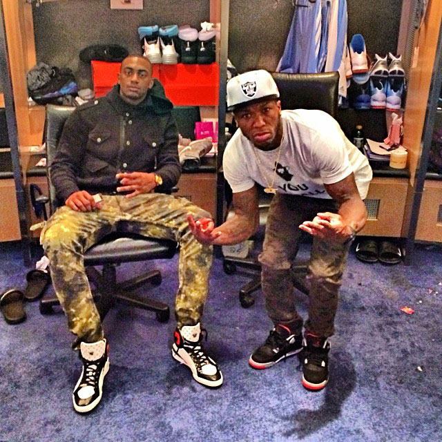 Nate Robinson wearing Air Jordan 4 Retro Black/Cement