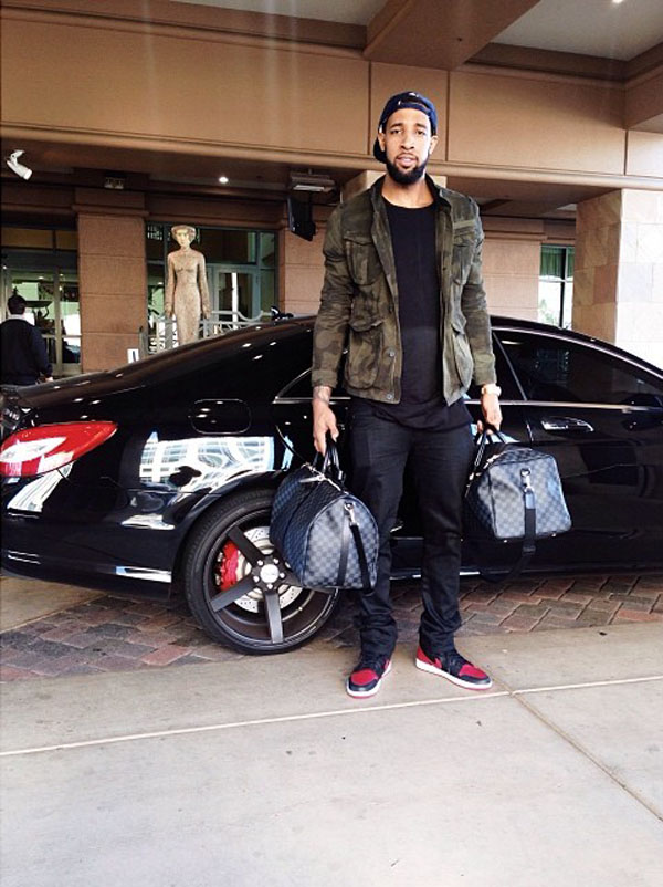 Derrick Williams wearing Air Jordan 1 Black/Red