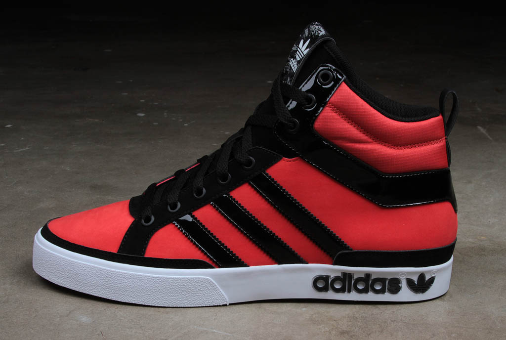 red and black high top adidas