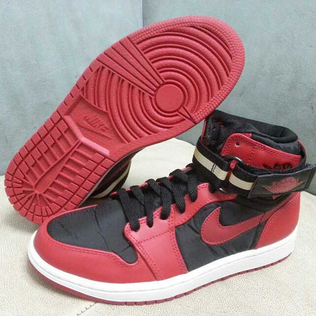 red and black jordans with strap