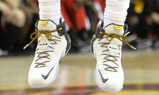 LeBron James wearing Nike LeBron XII 12 White/Black-Yellow PE on January 19, 2015