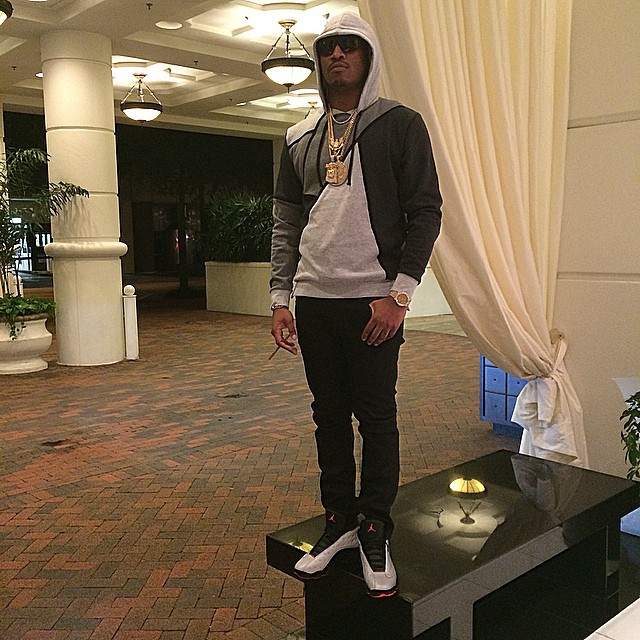 Future wearing Air Jordan XIII 13 Reflective Silver