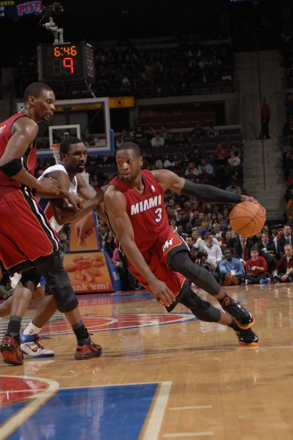 Dwyane Wade wears Black/Red/Orange Air Jordan 2011 PE against Pistons